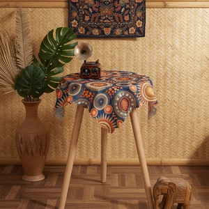 Detail of bohemian round tablecloth with sunflower patterns and ethnic geometric design