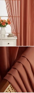 Close-up detail of brick red sheer curtain featuring elegant ruffled edges and soft texture