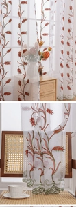 Detail of white sheer curtain with wheat embroidery and green scalloped lace edges