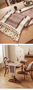Detailed weave pattern and long tassels of the brown striped farmhouse table runner