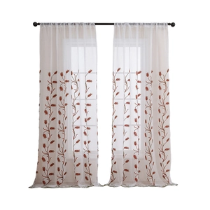 Sheer white country style curtains with embroidered wheat patterns and scalloped edges