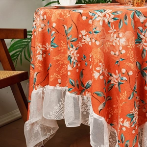 French style orange tablecloth with crane and floral pattern featuring white lace trim
