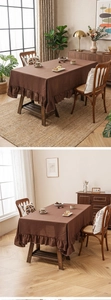 Close-up of coffee brown linen tablecloth featuring elegant ruffle edges and luxury texture