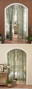 Detail of dark green lace curtain with floral vine texture and elegant ruffled edges
