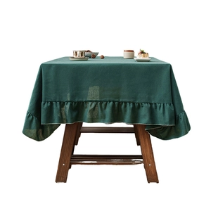 Linen table cloth with ruffle edge in dark green for rectangular dining tables