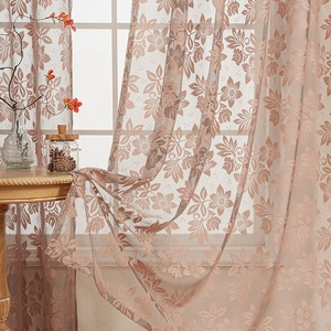 Elegant peach pink lace curtain with floral patterns for a cozy modern living room