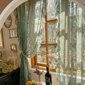 French vintage dark green lace door curtain with ruffled edges in a retro room setting
