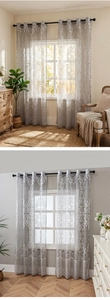 Detail of grey damask sheer curtains with silver grommets for living room decor