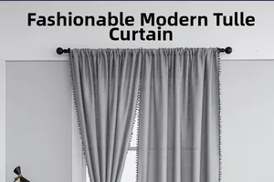 Detail of grey slub yarn semi-sheer curtain with elegant matching pom-pom fringe trim