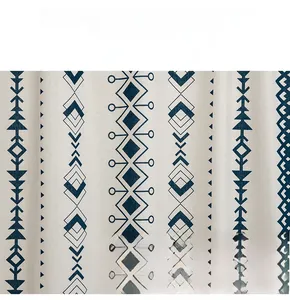 Close-up of soft cotton linen fabric with blue geometric patterns and ethnic motifs