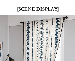 Detail of bohemian cotton linen curtain with navy geometric prints and black tassels