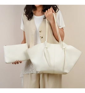 Chic cream white leather wing tote bag and matching clutch set with knot details