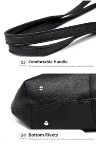 Detail of thickened handle and bottom metal studs on black lychee grain leather tote