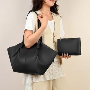 Black pebbled leather tote bag set with shoulder knot detail and matching pouch for women