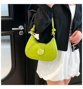Neon green baguette bag featuring knotted strap and silver D-buckle detail for women