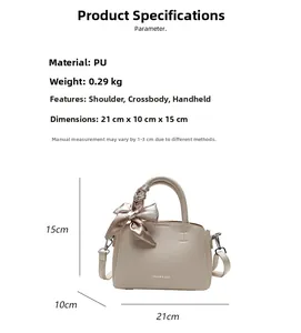 Detail view of beige bucket bag with dimensions 21x10x15cm and pink floral silk scarf