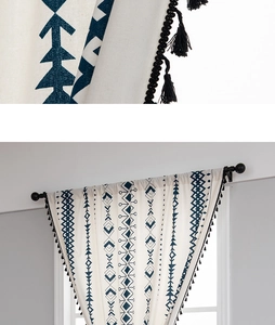 Close-up of bohemian linen curtain with geometric prints and black tassel fringe edges