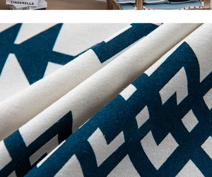 Macro shot of thick navy and beige bohemian cotton linen curtain fabric with geometric stars