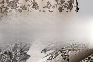 Detail of floral printed cotton linen fabric showing the fine texture and monochrome pattern