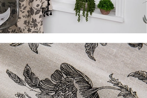 Detail of vintage floral print fabric with black tassels and textured cotton linen weave