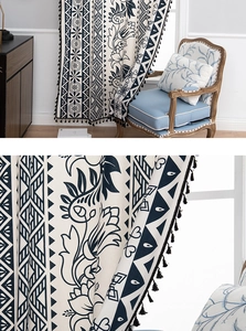 Detail of bohemian curtain with black geometric patterns and elegant tassel trim fringe