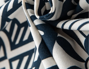 Detailed close-up of navy and cream cotton linen curtain with bohemian geometric pattern