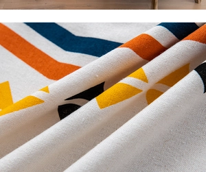 Detail of bohemian geometric print on thick linen cotton fabric with vibrant patterns