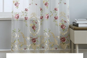Detail of white semi-sheer tulle curtain with elegant pink rose floral embroidery