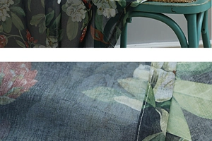 Close-up of floral print cotton-linen curtain fabric with vintage green flower patterns