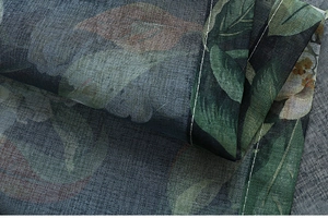 Close-up of American floral cotton linen curtain fabric with detailed stitching