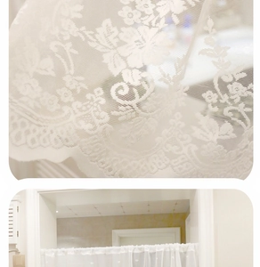 Close-up of white floral lace embroidery and wave edges on a Nordic door curtain