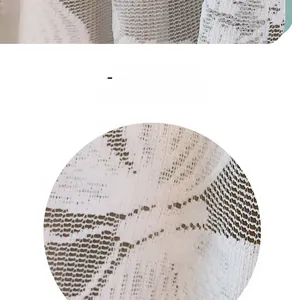 Detail of white lace fabric with intricate hollow flower patterns for window curtains
