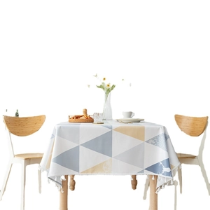 Nappe en PVC imperméable avec motifs géométriques bleu et jaune et pompons à franges