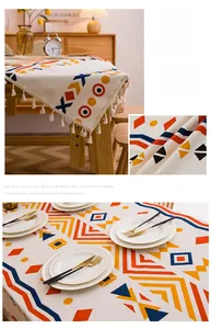 Detail of bohemian cotton linen tablecloth with colorful geometric patterns and white tassels
