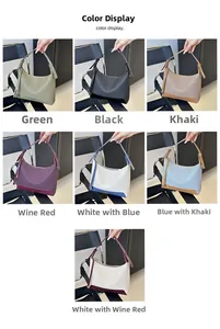 Detailed color display of faux leather underarm bags in various solid and bicolor options