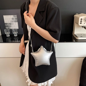 Silver star-shaped acrylic crossbody bag with metallic puffed texture and chain strap