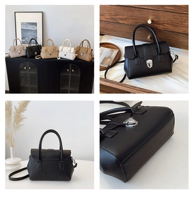 Détail de la texture cuir de lychee et du fermoir rotatif en métal argenté sur le sac