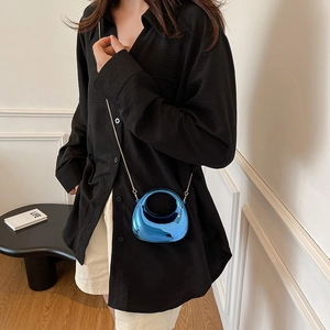 Mini glossy blue acrylic crossbody chain bag with metallic finish and circular top handle