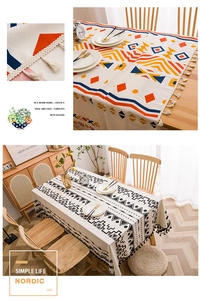 Close-up detail of Nordic linen tablecloth with geometric patterns and handmade tassels