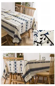 Detail of bohemian geometric cotton linen tablecloth with black tassel fringe and thick texture