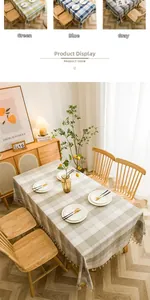 Close-up of minimalist plaid tablecloth with elegant white fringe details on the edges