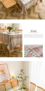 Close-up of pink and green plaid tablecloth featuring white tassel fringe details