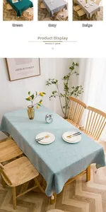 Detail of solid color linen tablecloth with decorative tassel balls and waterproof fabric