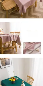 Detail of pink and dark green linen tablecloth with elegant white decorative tassels