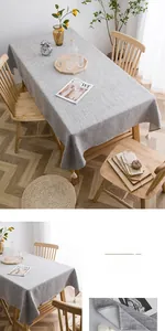 Detail of grey cotton linen tablecloth with white tassel edges in a Nordic minimalist style
