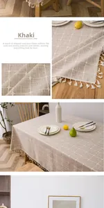 Close-up of khaki checkered linen tablecloth featuring elegant fringe tassel edges