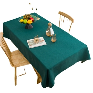 Waterproof dark green linen tablecloth on dining table with elegant texture