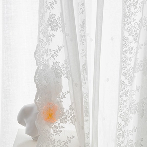 White lace curtain with floral patterns and wavy edges for French style home decor