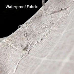 Waterproof Nordic tablecloth in light grey plaid fabric with water-repellent droplet effect