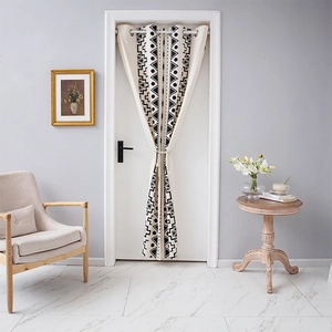 Detail of bohemian geometric kitchen door curtain with metal rings and tie-back cord